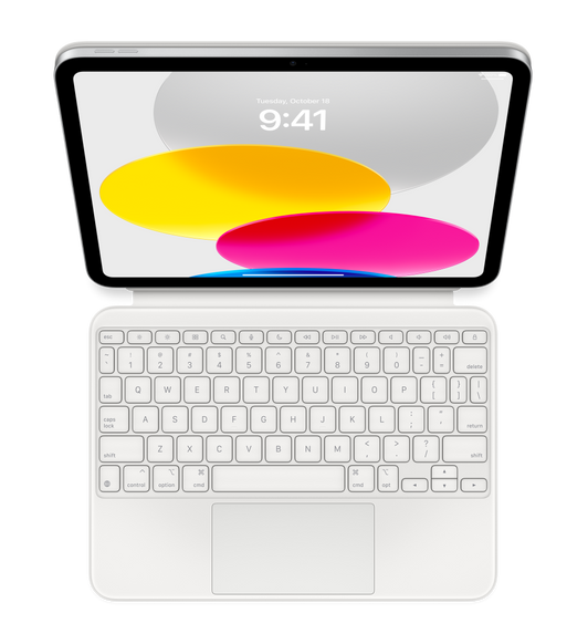 Top down view showing iPad connected to Magic Keyboard Folio laying flat. Screen displaying coloured circular graphics.