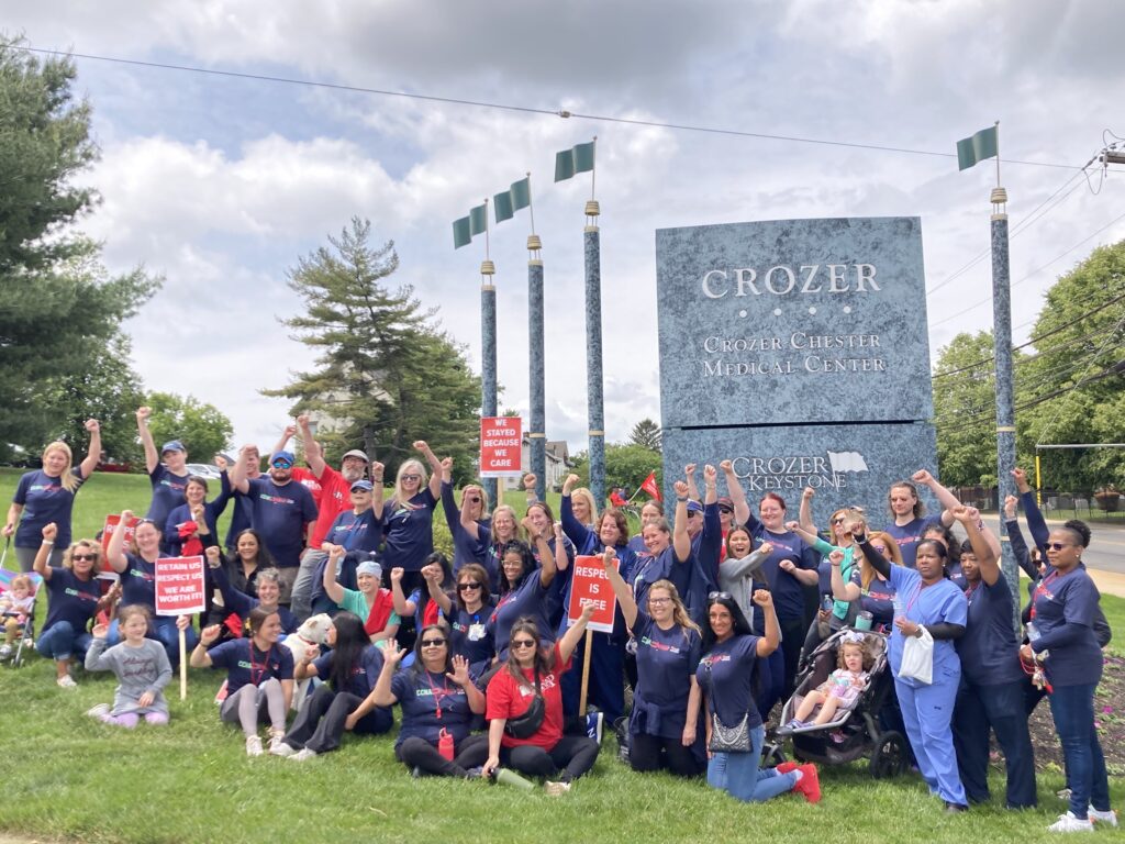 Nurses picket outside the hospital where they work.