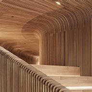 Steam-bent timber tunnels through Melbourne showroom by Woods Bagot
