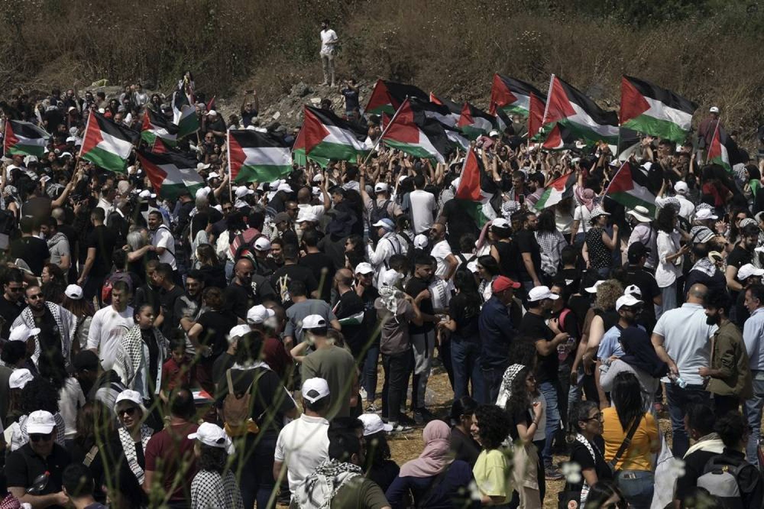 People take part in a march in support of the Palestinian people ahead of the Nakba day at the Kasayir village, in Haifa, Tuesday, May 14, 2024. (AP) 