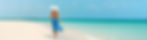 Luxury beach vacation elegant tourist woman walking relaxing in beachwear hat on white san
