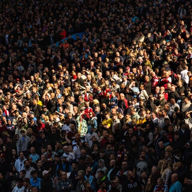 A wide shot of spectators at a Premier League match.