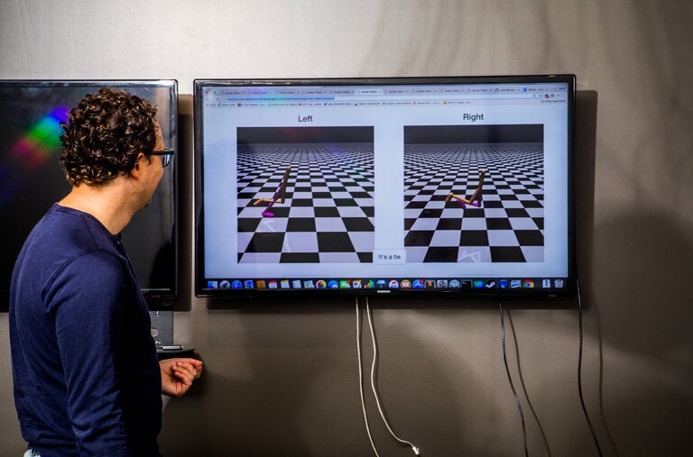 Dario Amodei demonstrates how the use of simple video games can be used to train the A.I. bots.